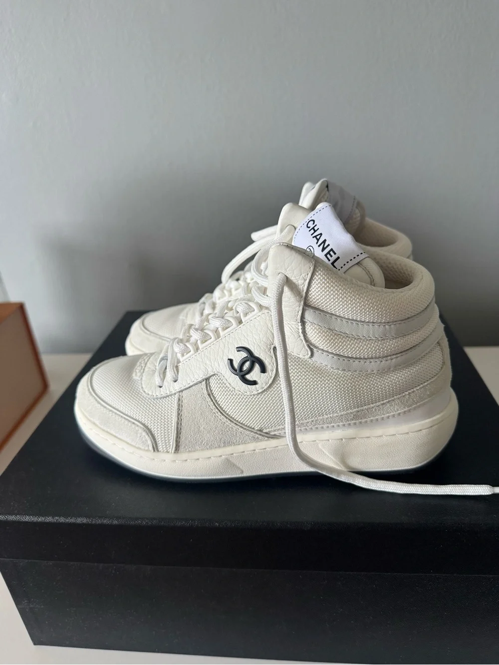 CHANEL White and Black High-Top Sneakers
